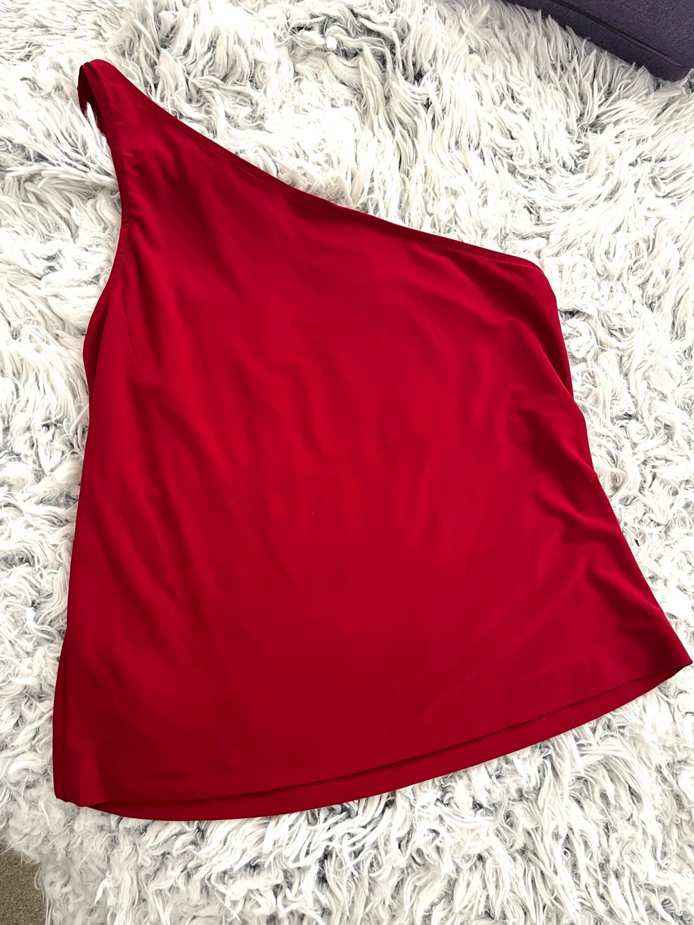 One-Shoulder Red Norma Kamali jersey top.